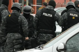 Percheziții într-un dosar de pornografie infantilă